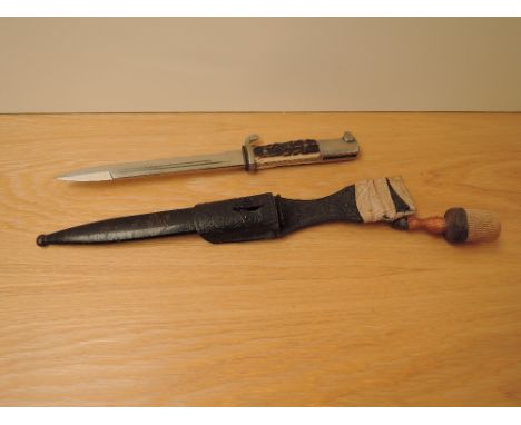 A WWII period German Dress Bayonet having spear point tip, blade marked WH Holler Solingen having metal scabbard, leather fro