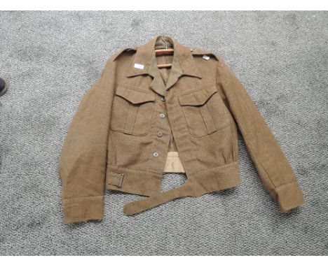 A WW2 period Battle Dress Blouse named B.Gyngell, marked WD military arrow 345, small size