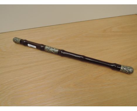 A Military Bamboo Swagger Stick having white metal decorated mounts, unscrews into two parts, length 44cm