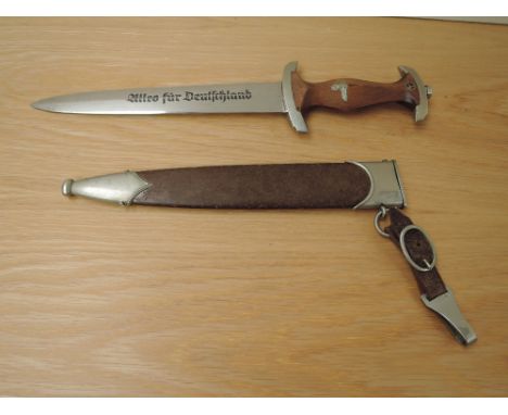 A German WWII SA Dagger, blade marked Alles Fur Deutschland, GEBR.BOHME NACHFL BROTTEROOS, crossguard marked SA, with brown m