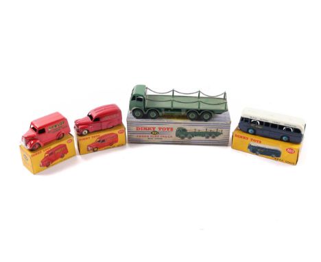 4 Dinky Toys. A Supertoys Foden Flat Truck with chains (905). An example in green. BOAC Coach (283) in dark blue and white. T