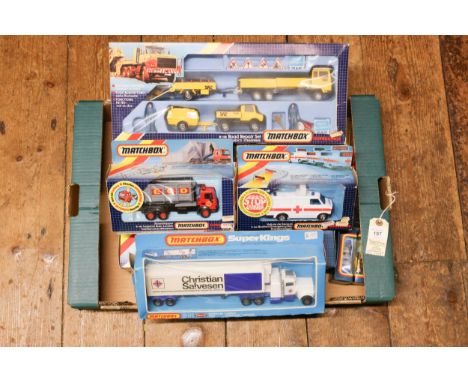 12 Matchbox models from 1980s /1990s period. Includes K-118 Road Repair Set containing vehicles, road signs and plastic figur