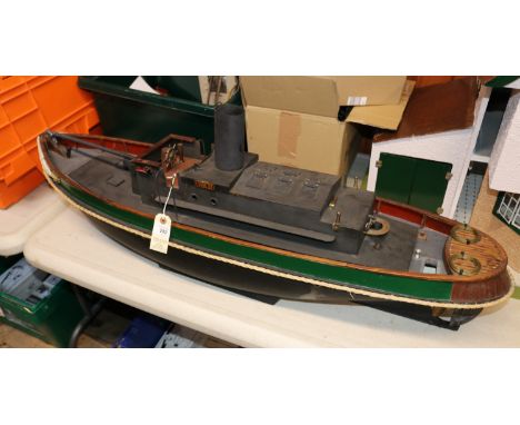 A diesel engined scale model tug named 'Cullimix'. The vessel was designed by Bernard Reeve M.S.N.R. as the Cullamix. A plank