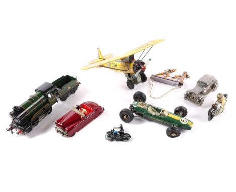 8 metal and tinplate toys, includes a Schuco radio 4012 in maroon with red seats, a Schuco lotus racing car in green with yel