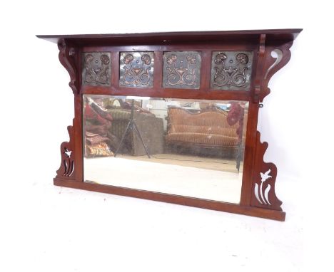 An Art Nouveau oval mantel mirror, with 4 stylised copper panels, W110cm, H76cm, D14cm 