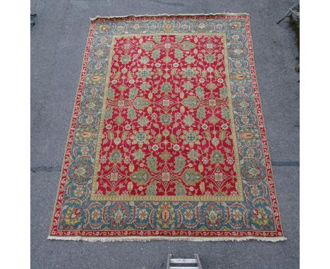 A red ground Persian design carpet, floral symmetrical decoration, 365cm x 276cm Carpet is in good overall condition, just so