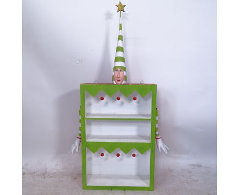 A unique Reuben McHugh clown wall shelf unit, with clown head and hanging arms, ex-Liberty's display