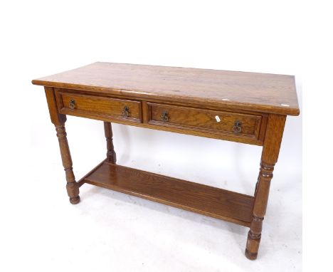 An oak hall table, with 2 frieze drawers and shelf under, on baluster turned legs, W117cm, H77cm, D53cm 