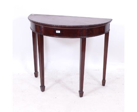 A mahogany demilune fold over card table, on square tapered legs with spade feet, W91cm, H78cm, D45cm 