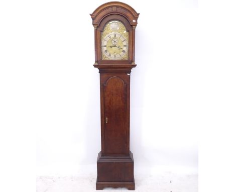 An 18th century 8-day oak longcase clock, having a 16" arch-top brass dial and subsidiary dial and date aperture, signed John