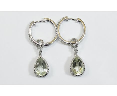 Green Amethyst Hoop and Pendant Earrings, each earring comprising a 2.75ct pear cut green amethyst set in a rhodium vermeil a