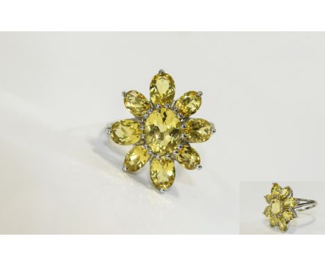 Canary Yellow Aquamarine Flower Ring, an oval cut of 1.5cts of the unusual canary aquamarine surrounded by a further eight 'p