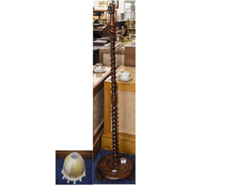 Standard Lamp Dark wood barley twist base with large dome shaped cream tasselled fabric shade. Approx height 52.5 inches