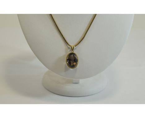 9ct Gold Set Large Faceted - Oval Shaped Amethyst Pendant with Attached 9ct Gold Chain. The Amethyst of About 10 cts. Fully H