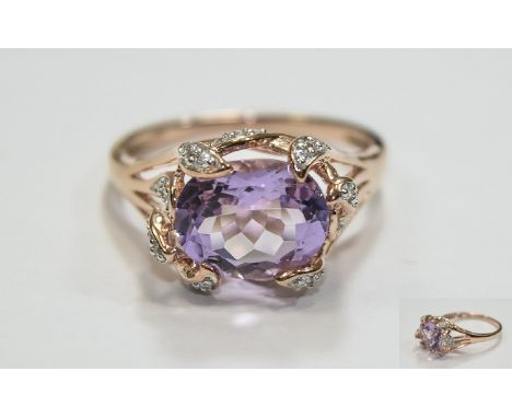 Rose De France Amethyst Ring, an oval cut solitaire of 3cts set across the finger, in rose gold vermeil, with .25ct natural w