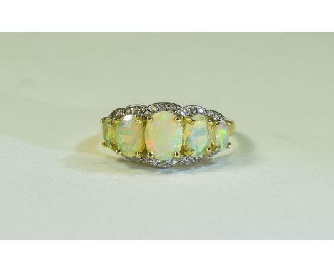 Natural Opal and and White Zircon Ring, five graduated, oval cut, natural Ethiopian opals with a magnificent display of colou