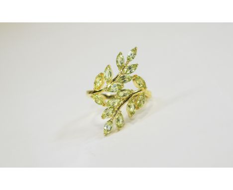 Peridot Leaves Crossover Ring, the leaves comprising 2.5cts of marquise cut bright green peridots, set on gold vermeil and si