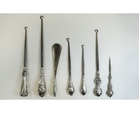 A Good Collection of Victorian and Edwardian Silver Ornate and Embossed Handle Button Hooks ( 7 ) In Total. Various Lengths. 