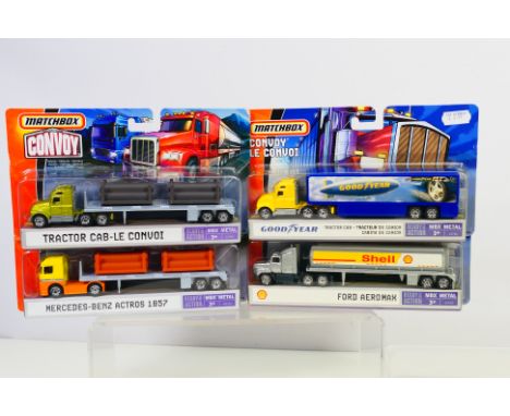 Matchbox Convoy - Four carded Matchbox diecast model trucks from the MBX Metal  'Convoy' series. Lot consists of Matchbox L39