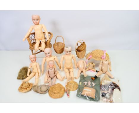 Georg Knodel - Armand Marseille - Heubach - A collection of bisque antique dolls heads by various makers which have been put 