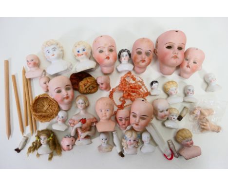 Bisque Dolls - A collection of bisque dolls heads in various sizes and bearing various makers marks. Some have cracks and min