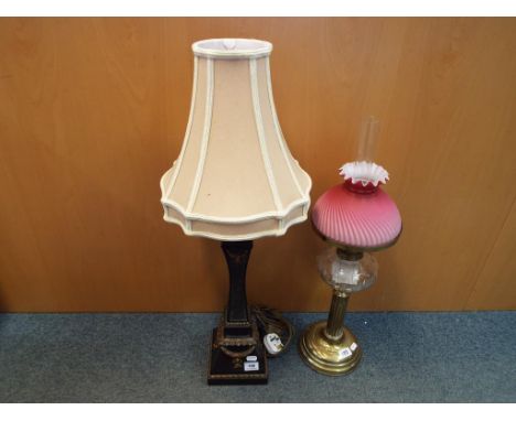 A brass and glass oil lamp with glass shade and funnel and a pillar standard lamp with neutral coloured shade.[2]Oil lamp has