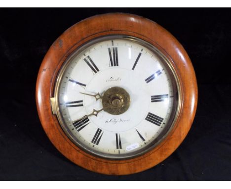 A good example of a Postman's alarm style wall clock, unusually having a cast brass bezel and glass covering the painted dial