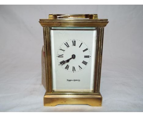 An good brass cased timepiece only mechanical carriage clock, white enamel dial with Roman numerals signed Mappin &amp; Webb.