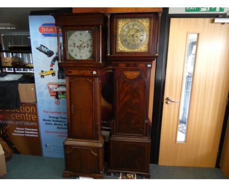 An early 19th century marquetry inlaid and crossbanded feathered mahogany veneered eight day longcase clock, the square brass