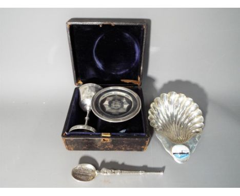 A Victorian silver hallmarked cased communion set, London assay 1860 (lacking bottle), a silver hallmarked anointing spoon an