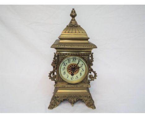 An Arts &amp; Crafts style cast brass pagoda form timepiece mantel clock, French movement stamped Japy Freres, stylised Arabi