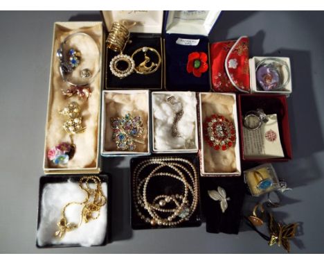 A good mixed lot of costume jewellery to include brooches, double stranded graduated pearl necklace, bangle, paired earrings,