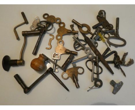 A box of assorted mantel and longcase clock keys (12+).