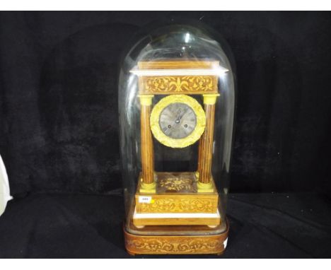 A good early to mid-19th century Empire clock, rosewood veneer and mahogany case with inlaid floral decoration and stringing,