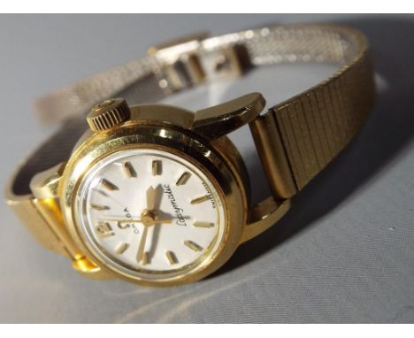 Omega - An 18 carat gold cased Omega Ladymatic cocktail watch, silvered dial with gold baton time indicators, Omega symbol an