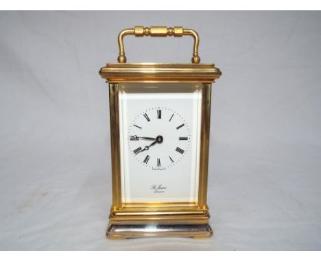 A good brass cased timepiece only mechanical carriage clock, signed to the white dial St James London.