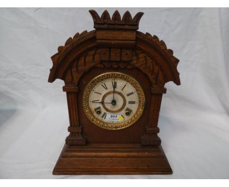 An Ansonia Tunis model mantel clock with pendulum, two-train gong striking movement, celluloid dial. 