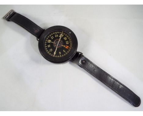 German World War Two (WWII) bakelite cased, liquid filled Kadlec AK39 Luftwaffe pilot's compass, black dial with white numera