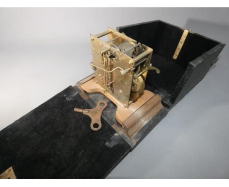 An unusual movement display case with two-train movement used as a stand to demonstrate to potential customers by commercial 