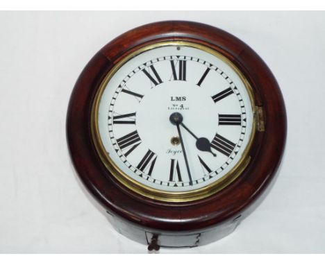 A mahogany cased dial clock, white painted dial with Roman numerals and marked LMS, No.4, Liverpool together with the name Jo