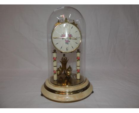 A Haller 400 day Anniversary clock with floral decoration, under a dome.