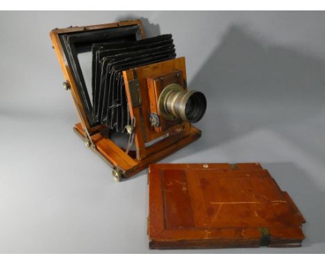 A Thornton Pickard mahogany and brass plate camera.