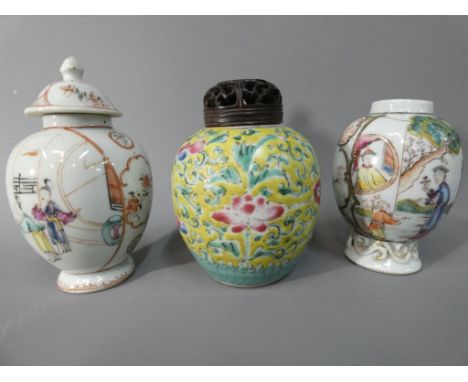 Three small Oriental vases, largest approximately 13 cm [h].Condition: The vase without the cover has two chips around the ri