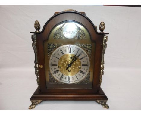 A contemporary English styled bracket clock, Dutch made with Hermle floating balance Westminster chime movement, arched brass