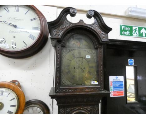 An oak cased 8-day longcase clock with 12 x 17 inch arched brass dial and moonphase, signed to the dial Elizabeth Moore, Loom