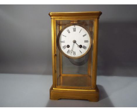 An early 20th century French four-glass mantel clock, hour and half past gong striking movementby Japy Freres with mercury pe