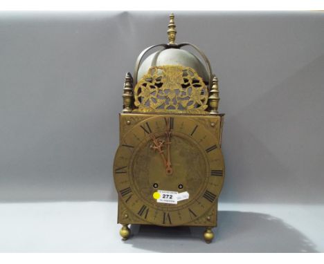 A large brass and wood lantern style mantel clock with French gong striking movement marked C L A Paris. 161 4.4 , 42 cm tall