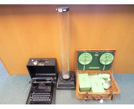 A vintage Everest typewriter in carry case, a picnic set in wicker basket and a water lamp (3)