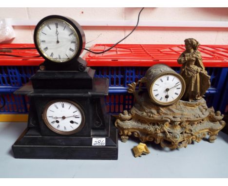 A mixed lot of three French mantel clocks to include an Egyptian revival black marble two train movement clock, a figural spe