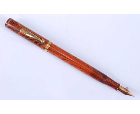A Waterman's Ideal No.7 Red Ripple fountain pen, the cap missing colour band, the lower band engraved FDW, the tapering ball-